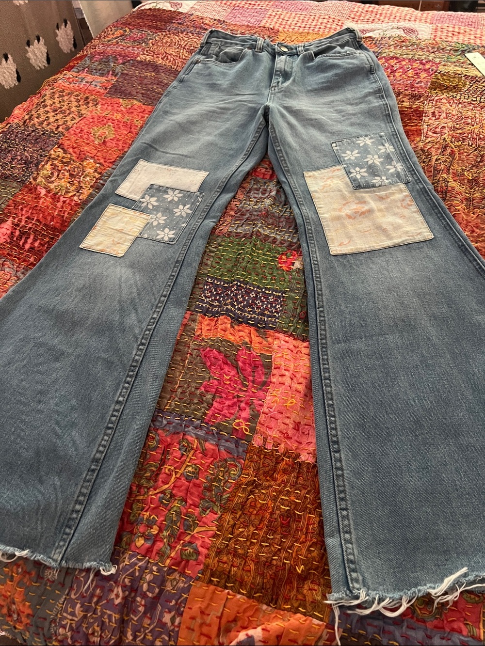 Wrangler women’s flared patchwork Jeans in Washed Blue